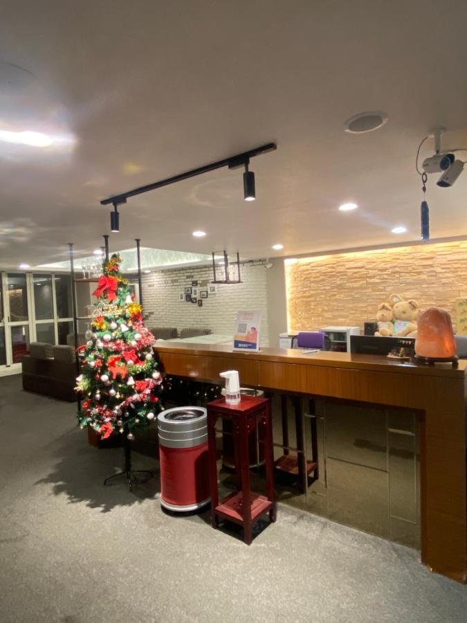 Aiyue Hotel Huwei Extérieur photo